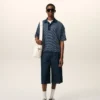 Ami de Coeur Polo a righe in cotone blu Ami de Coeur Polo a righe in cotone blu
