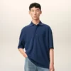 Ami de Coeur Polo in cotone blu con toppa in maglia
