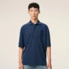 Ami de Coeur Polo in cotone blu con toppa in maglia