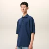 Ami de Coeur Polo in cotone blu con toppa in maglia