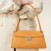 Borsa Mimi piccola in pelle di vacchetta arancione Borsa Mimi piccola in pelle di vacchetta arancione