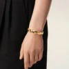 Bracciale in ottone dorato intrecciato Bracciale in ottone dorato intrecciato