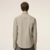Camicia aderente con volant a maniche lunghe in cotone beige Camicia aderente con volant a maniche lunghe in cotone beige