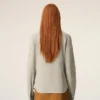 Camicia aderente con volant a maniche lunghe in cotone beige Camicia aderente con volant a maniche lunghe in cotone beige