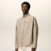 Camicia Ami de Coeur in cotone beige dal taglio squadrato con ricami Camicia Ami de Coeur in cotone beige dal taglio squadrato con ricami