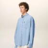 Camicia Ami de Coeur in cotone blu con ricamo, dal taglio squadrato Camicia Ami de Coeur in cotone blu con ricamo, dal taglio squadrato