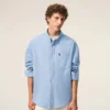 Camicia Ami de Coeur in cotone blu con ricamo, dal taglio squadrato Camicia Ami de Coeur in cotone blu con ricamo, dal taglio squadrato