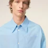 Camicia ampia Ami de Coeur in cotone blu con colletto a punta Camicia ampia Ami de Coeur in cotone blu con colletto a punta