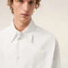 Camicia bianca in cotone con colletto a punta e motivo Ami de Coeur Camicia bianca in cotone con colletto a punta e motivo Ami de Coeur