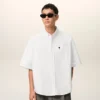 Camicia bianca in cotone dal taglio squadrato con ricamo Ami de Coeur Camicia bianca in cotone dal taglio squadrato con ricamo Ami de Coeur