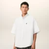 Camicia bianca in cotone dal taglio squadrato con ricamo Ami de Coeur Camicia bianca in cotone dal taglio squadrato con ricamo Ami de Coeur