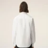 Camicia bianca in cotone su misura con ricamo Ami de Coeur Camicia bianca in cotone su misura con ricamo Ami de Coeur