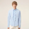 Camicia blu in cotone a maniche lunghe con volant e vestibilità aderente