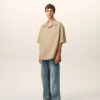 Camicia lunga a maniche corte in cotone beige con collo alla camp Camicia lunga a maniche corte in cotone beige con collo alla camp