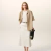 Camicia lunga a maniche corte in cotone beige con collo alla camp Camicia lunga a maniche corte in cotone beige con collo alla camp