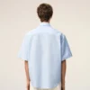 Camicia squadrata in cotone blu con ricami Ami de Coeur Camicia squadrata in cotone blu con ricami Ami de Coeur
