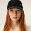 Cappellino Ami de Coeur in nylon nero con borchie Cappellino Ami de Coeur in nylon nero con borchie