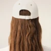 Cappellino Ami Paris in cotone bicolore beige e bianco Cappellino Ami Paris in cotone bicolore beige e bianco
