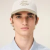 Cappellino Ami Paris in cotone bicolore beige e bianco Cappellino Ami Paris in cotone bicolore beige e bianco
