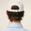 Cappellino Ami Paris in cotone bicolore beige e bianco Cappellino Ami Paris in cotone bicolore beige e bianco