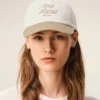 Cappellino Ami Paris in cotone bicolore beige e bianco Cappellino Ami Paris in cotone bicolore beige e bianco