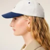 Cappellino Ami Paris in cotone bicolore blu e bianco Cappellino Ami Paris in cotone bicolore blu e bianco