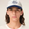 Cappellino Ami Paris in cotone bicolore blu e bianco Cappellino Ami Paris in cotone bicolore blu e bianco