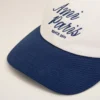 Cappellino Ami Paris in cotone bicolore blu e bianco Cappellino Ami Paris in cotone bicolore blu e bianco