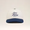 Cappellino Ami Paris in cotone bicolore blu e bianco Cappellino Ami Paris in cotone bicolore blu e bianco