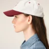 Cappellino Ami Paris in cotone bicolore rosso e bianco Cappellino Ami Paris in cotone bicolore rosso e bianco