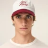 Cappellino Ami Paris in cotone bicolore rosso e bianco Cappellino Ami Paris in cotone bicolore rosso e bianco