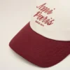 Cappellino Ami Paris in cotone bicolore rosso e bianco Cappellino Ami Paris in cotone bicolore rosso e bianco