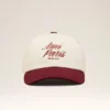 Cappellino Ami Paris in cotone bicolore rosso e bianco Cappellino Ami Paris in cotone bicolore rosso e bianco