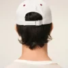 Cappellino Ami Paris in cotone bicolore rosso e bianco Cappellino Ami Paris in cotone bicolore rosso e bianco