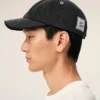 Cappellino Ami Paris in denim nero con toppa laterale Cappellino Ami Paris in denim nero con toppa laterale