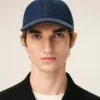 Cappellino con toppa laterale Ami Paris in denim blu Cappellino con toppa laterale Ami Paris in denim blu