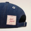 Cappellino con toppa laterale Ami Paris in denim blu Cappellino con toppa laterale Ami Paris in denim blu
