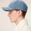 Cappellino in denim blu con ricamo “Ami de Coeur” Cappellino in denim blu con ricamo “Ami de Coeur”