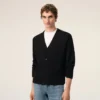 Cardigan in lana nera con Ami de Coeur a contrasto Cardigan in lana nera con Ami de Coeur a contrasto