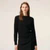 Cardigan nero in lana a girocollo con Ami de Coeur a contrasto Cardigan nero in lana a girocollo con Ami de Coeur a contrasto