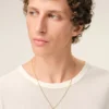 Collana con ciondolo “0” in ottone martellato dorato Collana con ciondolo “0” in ottone martellato dorato