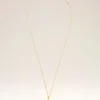 Collana con ciondolo “4” in ottone martellato dorato Collana con ciondolo “4” in ottone martellato dorato