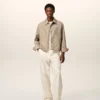 Giacca Ami de Coeur in nylon beige con bottoni a borchia Giacca Ami de Coeur in nylon beige con bottoni a borchia