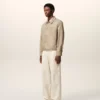Giacca Ami de Coeur in nylon beige con bottoni a borchia Giacca Ami de Coeur in nylon beige con bottoni a borchia