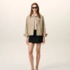 Giacca Ami de Coeur in nylon beige con bottoni a borchia Giacca Ami de Coeur in nylon beige con bottoni a borchia