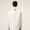 Giacca da lavoro in cotone bianco con bottoni Giacca da lavoro in cotone bianco con bottoni