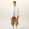 Giacca imbottita in nylon bianco con bottoni Giacca imbottita in nylon bianco con bottoni