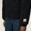 Giacca imbottita in nylon nero Giacca imbottita in nylon nero
