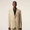 Giacca squadrata monopetto in lana vergine beige Giacca squadrata monopetto in lana vergine beige