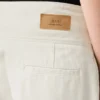 Jeans a zampa d’elefante con cintura avvolgente in cotone bianco